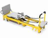 DZ178 commercial mega reformer with yellow iron frame and grey upholstery