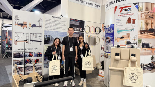 Visitors at TMAX Pilates Booth 234 with Pilates reformers at AusFitness Sydney 2026