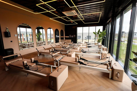 UK Pilates studio fitted with customised light-coloured aluminium reformer machines