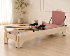 DZ184 maple Pilates reformer in a premium studio setting