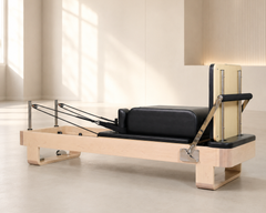 DZ185 professional wooden Pilates reformer in studio setting