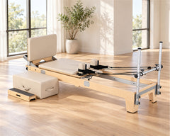 DZ1862 Canadian maple reformer in a daylight Pilates studio — illustrative setting